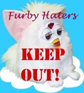 An image of a Furby, with superimposed text: Furby haters keep out!
